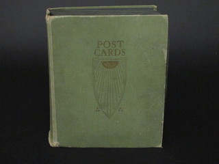 A green album of coloured postcards