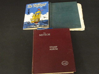 A Trafalgar stamp album, a Stanley Gibbons swift sure stamp  album and The Metro stamp album