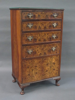A Queen Anne style figured walnut chest of 4 long drawers  above a double cupboard, raised on cabriole supports 26"