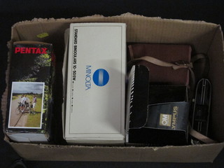 A Popular Brownie camera, a folding camera, a Pentax ESPIO7 30 camera, an Olympus flash, a lens and a pair of Minolta 10 x  50 binoculars