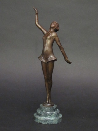 An Art Deco style bronze figure of a standing lady, raised on a stepped granite socle base 14"