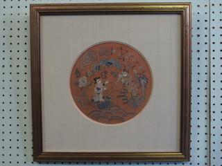 A red silk Chinese embroidered roundel decorated figures 8", the  reverse with certificate of antiquity from Teresa Coleman Fine  Art Ltd