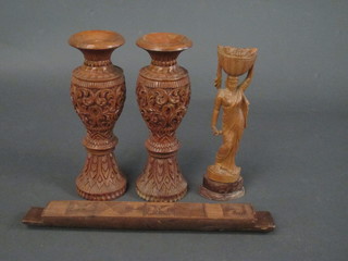 A carved wooden "butter stamp", 2 carved Eastern vases and a  carved figure of a lady 12"