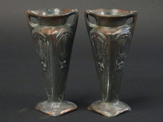 A pair of Art Nouveau twin handled metal vases with grape  decoration 6"