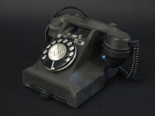 A black Bakelite dial telephone with drawer, the base marked  328F
