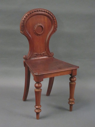 A 19th Century mahogany hall chair with solid seat raised on  turned supports, the base marked WC Webb of Liverpool