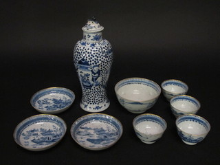 An Oriental blue and white urn and cover the base with 4  character mark 10", f and r, a circular blue and white bowl 5", 3  Oriental blue and white saucers and 4 tea bowls