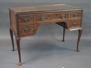 A Queen Anne style walnut side/dressing table fitted 1 long drawer flanked by 4 short drawers, raised on cabriole supports  45"