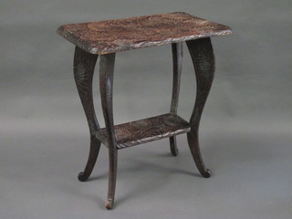 A rectangular Oriental hardwood 2 tier occasional table, carved chrysanthemums, raised on cabriole supports 25"