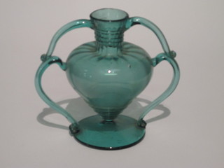 A hand blown turquoise coloured glass twin handled vase 8"
