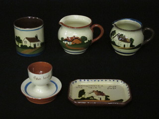 A collection of items of Torquay Mottoware