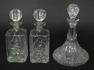 A pair of cut glass spirit decanters and a cut glass ships decanter