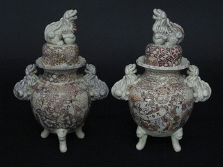 A pair of Japanese Satsuma twin handled urns and covers the lids decorated Dogs of Fo 12", lids f and r,