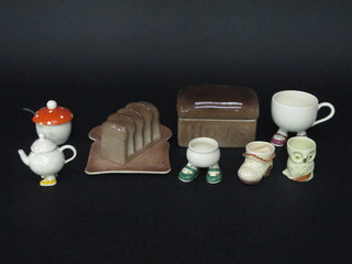 A rectangular Carltonware box in the form of a Hovis loaf 6", do. plate, toast rack and a collection of Carltonware egg cups etc