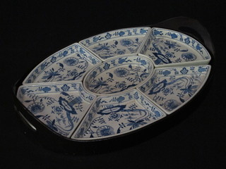 A Booths blue and white oval sectioned hors d'eouvres dish contained in a wooden twin handled tray