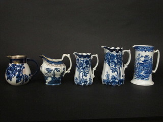 A Royal Doulton Flo Blue pattern jug with silver rim 6" together  with 4 other jugs
