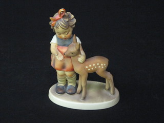 A Goebel figure of a standing girl with deer, base impressed  1947 5"