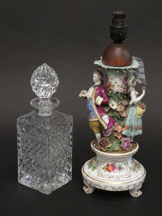 A cut glass spirit decanter and stopper and a Continental  porcelain table lamp base decorated a figure of a lady and  gentleman, f, 12"