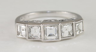 A lady's 18ct white gold dress ring set 5 Princess cut diamonds, approx 1.60ct