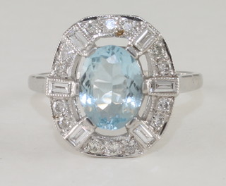 An 18ct white gold dress ring set an aquamarine and diamonds,  approx 1.70/0.50ct