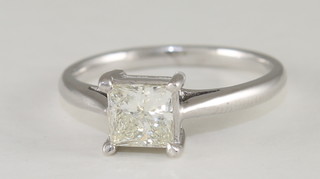 An 18ct white gold dress/engagement ring set a square cut solitaire diamond, approx 0.9ct