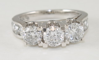 An 14ct white gold dress ring set 3 diamonds and with diamonds  to the shoulders, approx 2.85ct  ILLUSTRATED