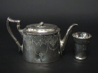 An oval engraved Britannia metal teapot PLEASE NOTE THE BEAKER THAT IS SHOWN IN THE IMAGE IS LOT 882 AND WILL BE SOLD SEPARATELY.