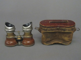 A pair of leather and gilt metal opera glasses
