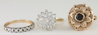 A gold floral set dress ring, a 9ct gold dress ring set illusion set diamonds and 1 other dress ring