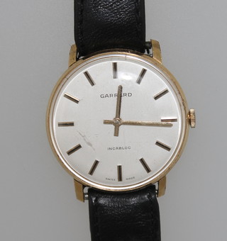 A gentleman's Garrard wristwatch contained in a gold case