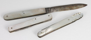 A folding silver bladed fruit knife with mother of pearl grip and  2 other fruit knives