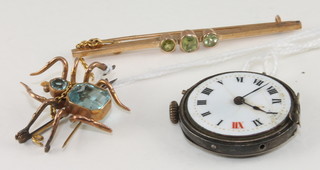 A 9ct gold bar brooch set peridot, a gilt metal bar brooch in the form of a spider and a silver cased wristwatch
