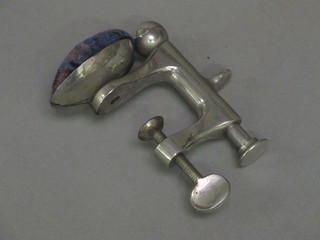 A chromium plated table mounting pin cushion vice