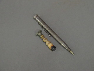 A silver cased propelling pencil and a seal