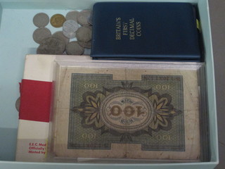 A collection of coins, bank notes etc