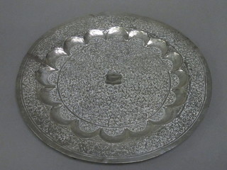 An Eastern embossed white metal charger 14"
