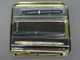 A blue Parker Duofold fountain pen, a green fountain pen, a Sheaffer fountain pen in a gilt case, a Sheaffer propelling pencil  etc