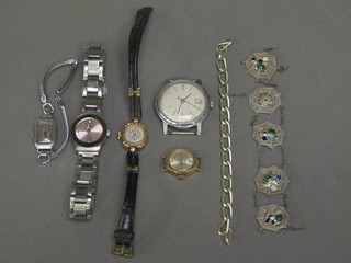 A silver spider's web bracelet and a collection of wristwatches