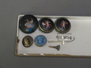 3 lacquered studs, 2 other studs, a small watch key and a hardstone cross
