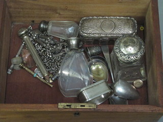 A 19th Century wooden box with hinged lid containing a glass jar with silver lid, 2 scent bottles with silver lids and a small  collection of silver items