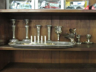 A rectangular engraved silver plated tray, a toast rack, pair of candlesticks etc