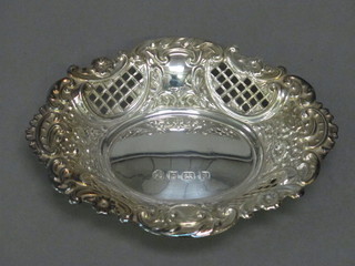 A modern oval pierced silver pin tray