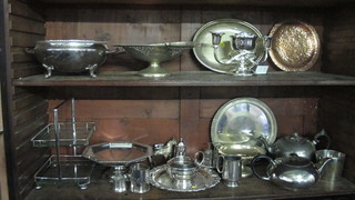 A circular silver twin handled dish, a pierced cake basket with  swing handle and a collection of plated items