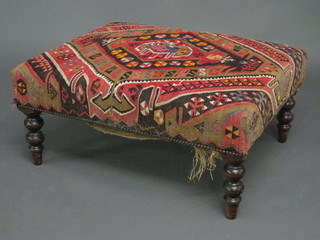 A rectangular mahogany footstool upholstered in Kelim material  33"