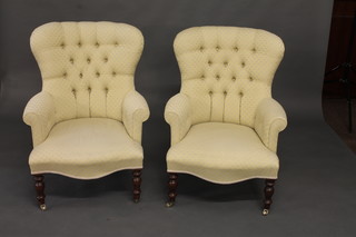 A pair of Victorian style mahogany armchairs upholstered in  yellow buttoned back material