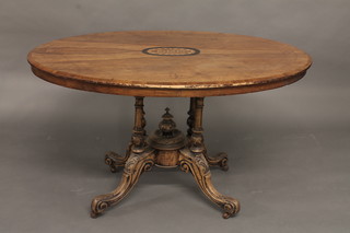 A Victorian oval inlaid walnut Loo table, raised on 4 turned  columns with scroll supports 47"