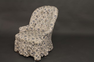 An iron framed armchair with blue fleck loose cover