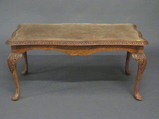 A Queen Anne style rectangular bleached walnut coffee table, raised on cabriole supports 37"