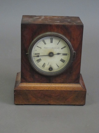 A 19th Century Continental 8 day mantel clock contained in a walnut case, the paper dial with Roman numerals marked  Camerer Kuss & Co