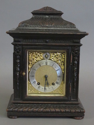 An Edwardian 8 day striking bracket clock with gilt dial and silvered chapter ring and Roman numerals, the dial marked C S  Proctor Newcastle Upon Tyne, contained in a heavily carved oak  case  ILLUSTRATED
